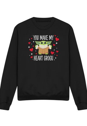 Black sweatshirt with cartoon green alien in brown robe surrounded by red hearts and text "You make my heart Grogu."