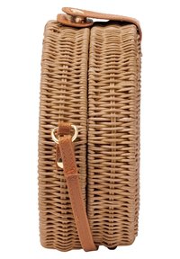 Woven straw bag in tan with a rectangular shape, leather strap, and gold hardware accent. Features a textured, natural finish.