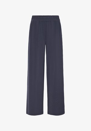 Pantalons larges de couleur marine avec une taille élastique, texture lisse et design fluide. Coutures plates et aucun détail matériel supplémentaire.