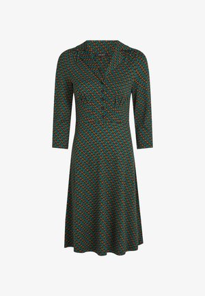Groene jurk met driekwartmouwen, voorzien van een geometrisch patroon in oranje en blauw. V-hals en uitlopende rokontwerp. Zachte stof.