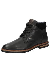 Stivaletti neri in pelle con texture liscia, punta rotonda e suola marrone. Presentano un design con lacci e dettagli di cucitura a contrasto.