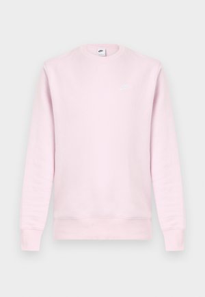 Šviesiai rožinis džemperis su apvalia iškirpte ir ilgomis rankovėmis. Ant krūtinės yra mažas baltas „Nike“ logotipas. Lygus tekstūros ir paprasto dizaino.