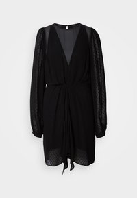Robe noire jusqu'aux genoux avec des manches longues en tulle à pois transparents, un décolleté en V profond et un détail noué froncé à la taille.