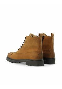 Braune Lederstiefeletten mit Gummisohle, Schnürverschluss vorne und seitlichem Reißverschluss. Mit einer strukturierten Oberfläche und verstärkter Zehenkappe.