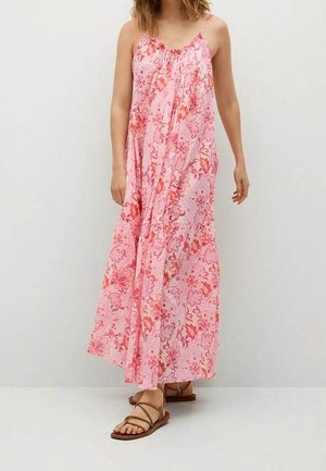Pink floral maxi dress with thin straps, lightweight fabric, and gathered neckline. Features vibrant patterns in shades of pink and orange.