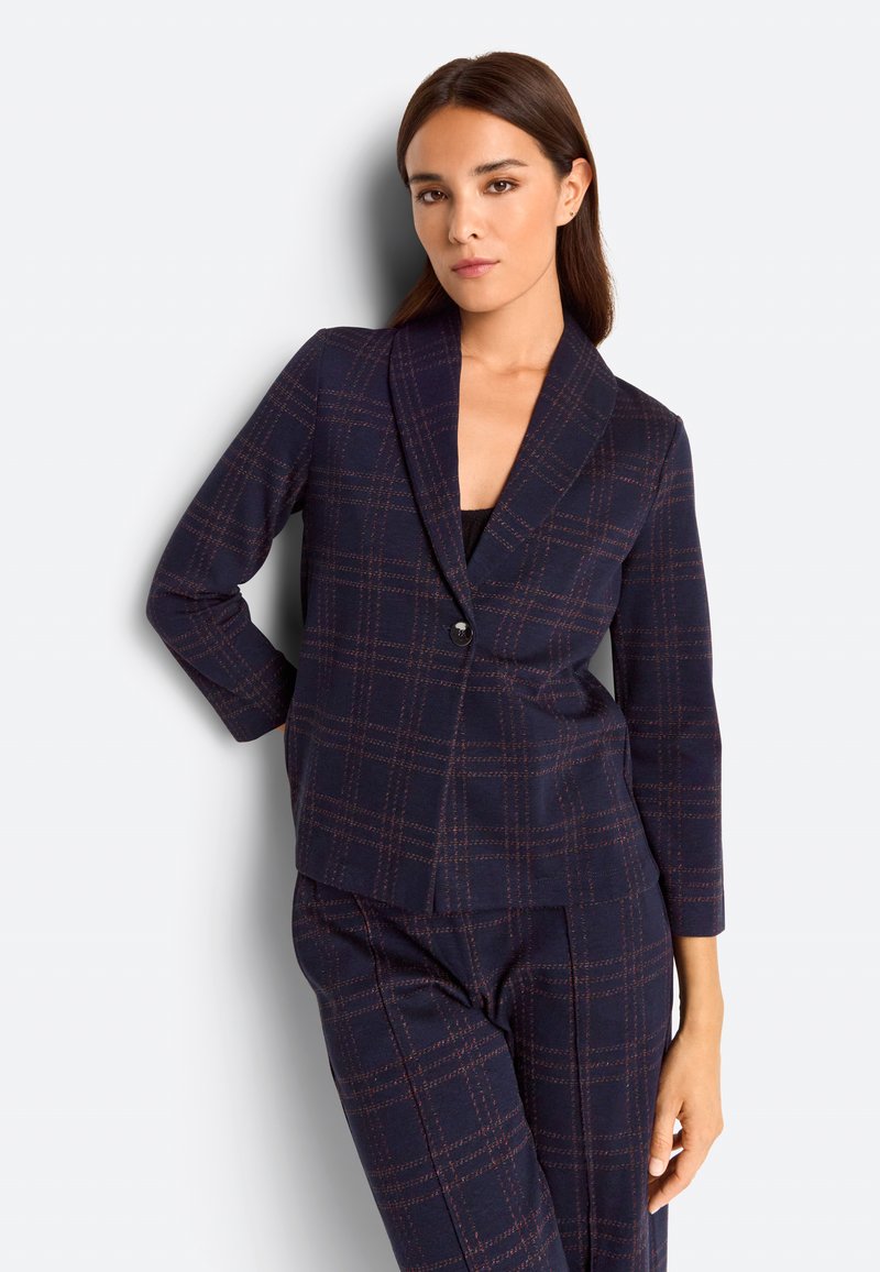 Navy blazer with a plaid pattern in dark orange and hints of light blue. Features a shawl collar, single button closure, and three-quarter sleeves.