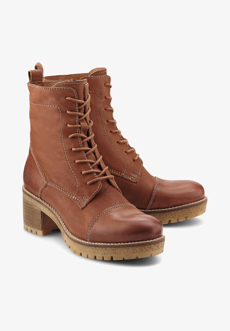 Brown leather ankle boots with a lace-up design, rounded toe, and a stacked heel. Contrast stitching and rubber sole for traction.