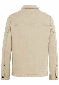 Beige bomuldsjakke med krave, synlig syning og en firkantet lap på øverste ryg. Har knapmanchetter og sidesømme.