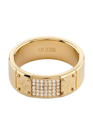 Anello a fascia in metallo color oro con cristalli trasparenti incastonati sulla parte anteriore e "GUESS" inciso all'interno della fascia.