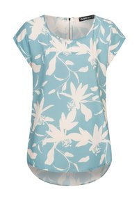 Haut bleu clair avec motifs floraux blancs, encolure ronde, manches courtes et ourlet légèrement asymétrique. Fermeture zippée au dos.