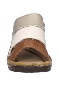 Brown and beige leather slide sandal with three horizontal straps and a textured footbed. Sturdy sole with visible stitching details.