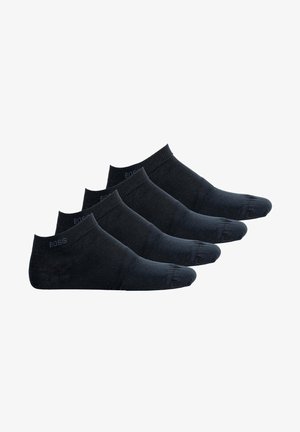 Schwarze Knöchelsocken im Set von vier. Mit einem gerippten Bündchen und einer glatten Textur, ergänzt durch ein dezentes Logodetail an der Seite.