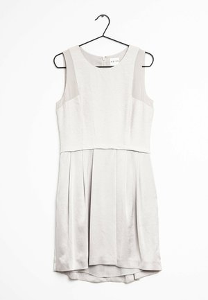 Sleeveless white dress with textured bodice and pleated skirt hanging on black hanger against white background.