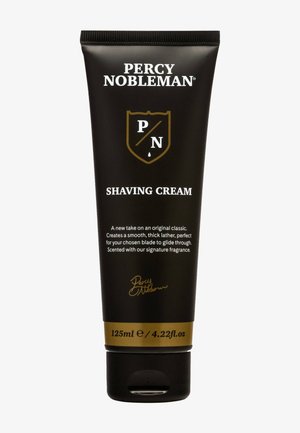 Tube noir de crème à raser Percy Nobleman avec texte doré et blanc, taille 125 ml, debout avec bouchon à bascule.
