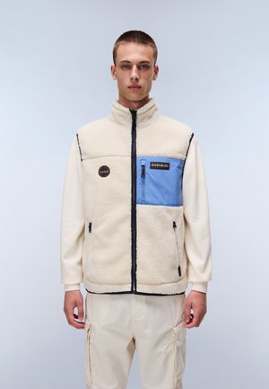 Fleece vest in cream with blue pocket, zip closure, high collar, and embroidered logo. Features black accents and side pockets.
