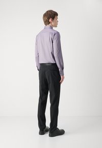 Light purple long-sleeve shirt with button cuffs paired with black trousers. The shirt has a slim fit and a structured collar, smooth texture.