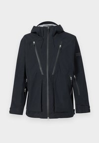 Must mustaga suurustega must kapuutsiga jakk, millel on mitu vertikaalset lukuga taskut rinnal, kätes ja külgedel. Jakk sisaldab reguleeritavaid randme rihmasid ja ees olevat lukku.