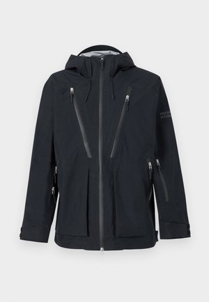 Zwarte kaptrui met meerdere verticale ritszakken op de borst, armen en zijkanten, met verstelbare polsbanden en een ritsluiting aan de voorkant.