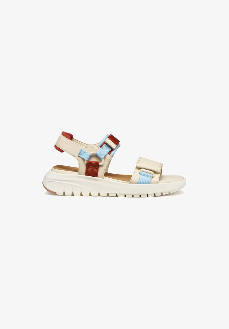 Beige sandal with thick white sole, adjustable light blue and rust red straps over foot and ankle, open toe and heel design.