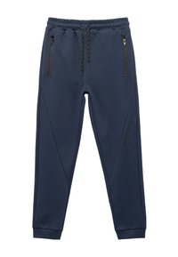 Marine joggerbukser lavet af blødt stof med elastisk talje og justerbar snøre, der har to lynlåslommer og sidelæg.