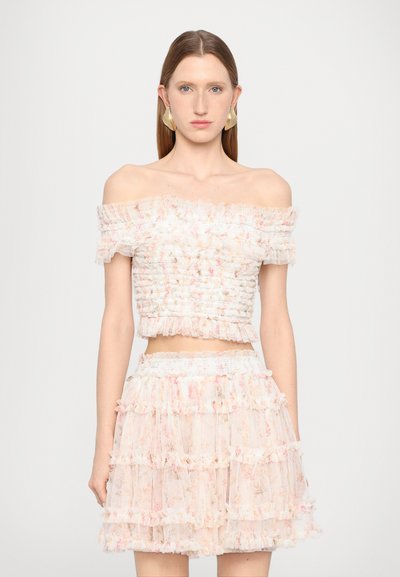 Off-the-shoulder top and matching tiered skirt made of sheer, floral-patterned fabric in pastel shades, featuring ruffled accents and smocked detailing.