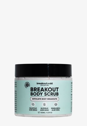Pot de gommage corporel Breakout avec couvercle noir, étiqueté pour exfolier les poussées corporelles avec acide salicylique, acide glycolique, squalane et aloe vera.
