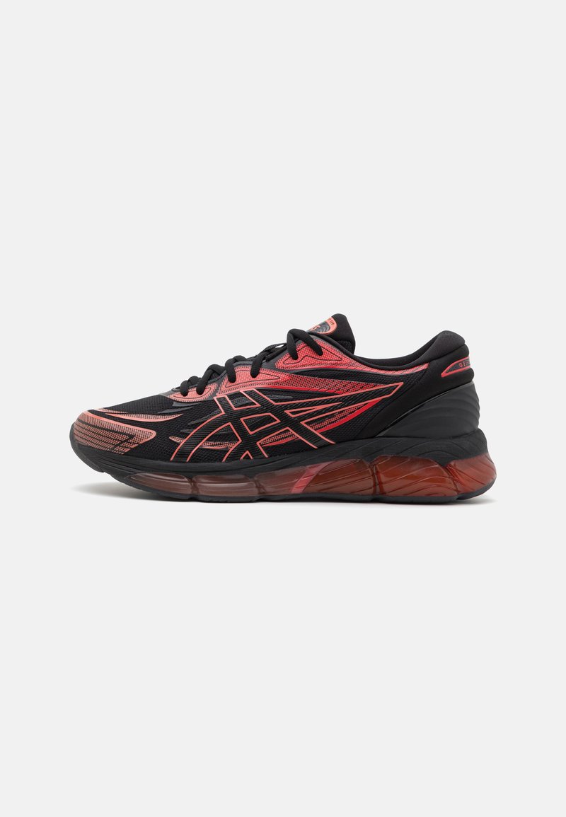 Black and red athletic shoe with a textured upper, curved sole, and angular design accents. Features laces and a cushioned heel.