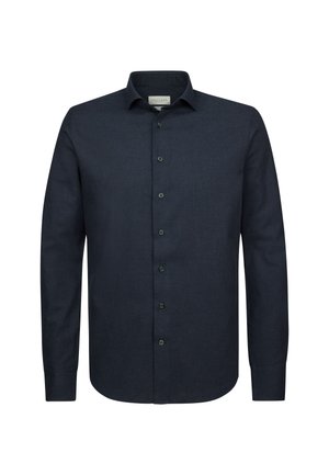 Chemise bleu foncé à manches longues en tissu texturé, avec un col pointu et des poignets à boutons.