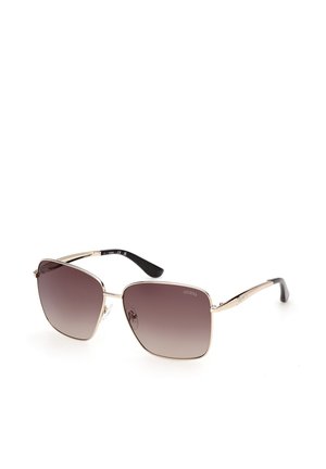 Lunettes de soleil à monture métallique avec verres carrés dégradés marron, branches noires et dorées, et plaquettes de nez ajustables sur fond blanc.