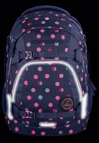 Navy backpack with pink and light blue polka dots. Features reflective accents, adjustable straps, and a round logo patch. Durable material.