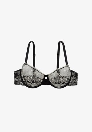Reggiseno nero con sovrapposizione di pizzo floreale, rifinito con una bordatura volant ai bordi. Presenta spalline regolabili e un dettaglio a chiave al centro davanti.