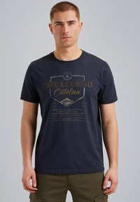 Navy blue cotton t-shirt with a round neck, featuring gold print detailing stating "PME LEGEND Catalina" on the front. Short sleeves.