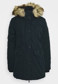 Zwarte parka jas met een gevoerde capuchon van bont, knoopsluitingen, klepzakken en een gladde, dikke stoftextuur voor warmte.