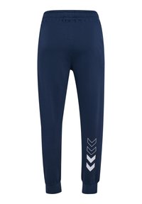 Marineblaue Jogginghosen aus weichem Stoff, mit einem elastischen Bund, schmal zulaufenden Beinen und einem weißen Zickzackmuster am linken Bein.