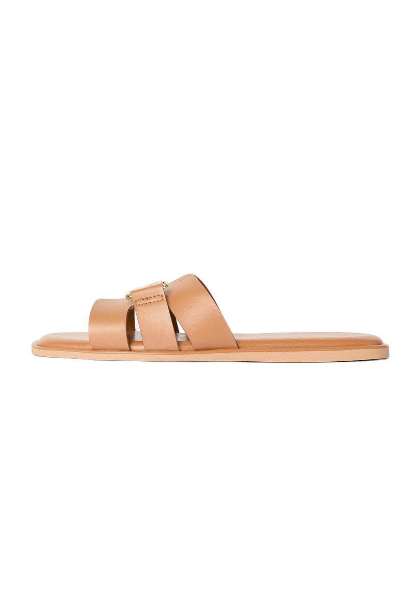 Tan leather slide sandals featuring two wide straps, a flat sole, and a subtle gold accent on the center strap. Smooth texture throughout.