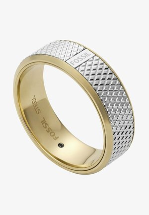 Bague Fossil en or et argent avec une bande en argent texturée et des bords en or lisses, gravée "FOSSIL" à l'intérieur et à l'extérieur.