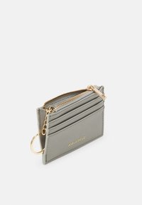 Grey synthetic cardholder with five card slots, a zippered compartment, and gold hardware accents. Features a keyring attachment.