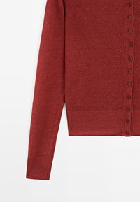 Red knitted cardigan with a crew neck, long sleeves, and button closure down the front. Smooth texture, ribbed hem and cuffs.
