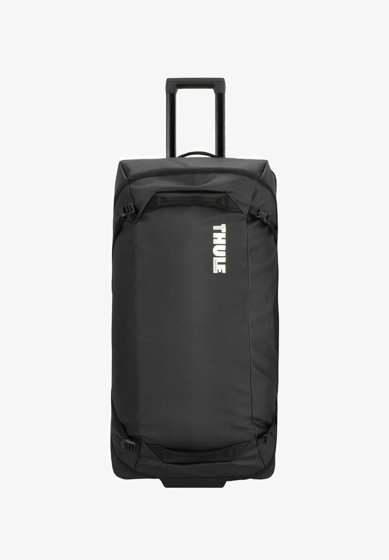 Black rolling duffel bag with sturdy handle, zippered main compartment, and adjustable side straps. Features prominent white "THULE" logo.