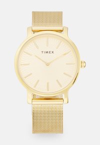 Montre Timex dorée avec un cadran texturé, des index horaires minimalistes et un bracelet en maille avec une fermeture à clapet pour un ajustement sécurisé.