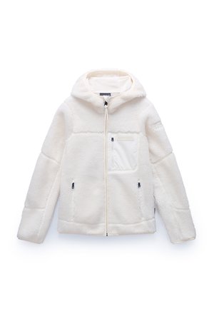 Fleece jacket in cream with a hood, zip closure, one front pocket, and side pockets. Features textured fabric and contrasting accents.