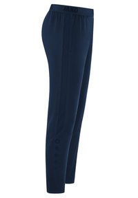 Pantaloni sportivi navy con un cinturino elastico, pannelli laterali testurizzati e accentuazioni circolari vicino ai polsini. Materiale morbido e leggero.