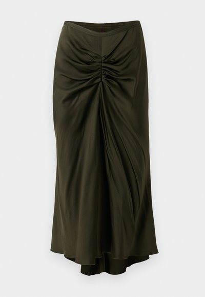 Ráncolt olívazöld szoknya sima, folyékony anyagból. Magas dereka és aszimmetrikus szegélye van, ami plusz dimenziót ad neki.
