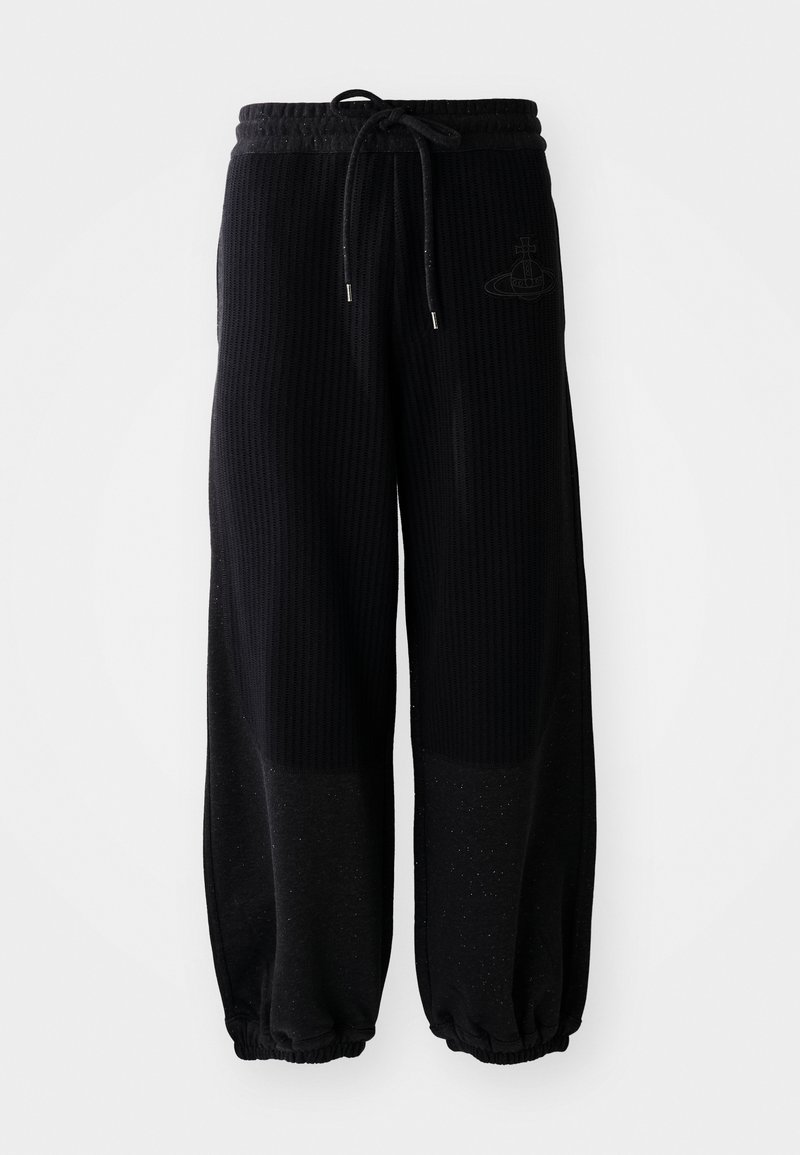 Pantalon de jogging large noir à côtes avec une taille élastique et un cordon de serrage. Présente un logo discret, un tissu texturé et des poignets froncés.
