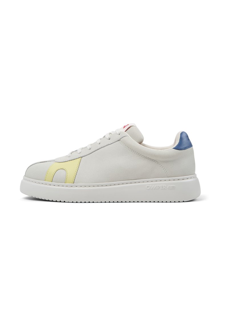 White leather sneaker with a yellow accent on the side and a blue heel. Features a white rubber sole and classic lace-up design.