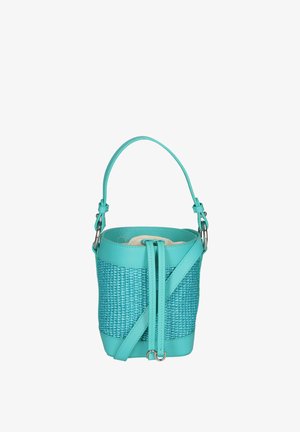 Sac seau en toile turquoise avec une partie supérieure en cuir lisse. Il dispose d'une bandoulière amovible et d'accents en métal argenté. Intérieur doublé d'un matériau léger.