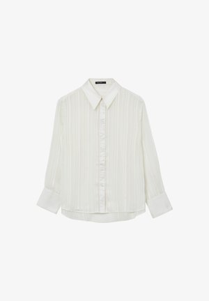 Blusa bianca a maniche lunghe con righe verticali, chiusura a bottoni sul davanti, colletto a punta e polsini larghi.
