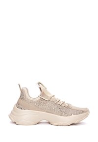 Beige athletic shoe with a textured knit upper, embellished with rhinestones, and a chunky rubber sole. Features a pull tab on the heel.
