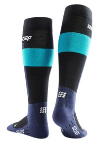 Kompressionssocken in Schwarz mit Teal- und Marine-Design. Sie verfügen über eine verstärkte Fußgewölbeunterstützung, feuchtigkeitsableitenden Stoff und Mesh-Einsätze für Atmungsaktivität.