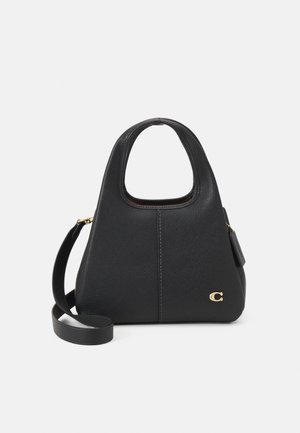 Black leather handbag with a rounded top handle, an adjustable strap, and a gold logo accent. Features a textured surface and a zip pocket.